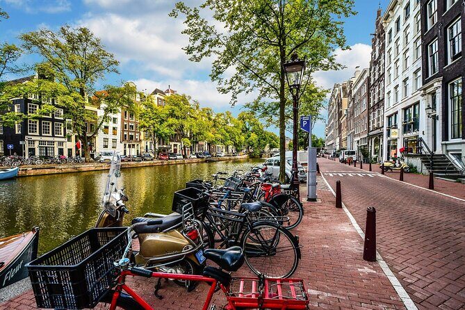 Amsterdam Day Trip from Brussels With Cheese, Clogs and Windmills - Dam Square and the Royal Palace Facade: The Amsterdam You Can Spot Fast