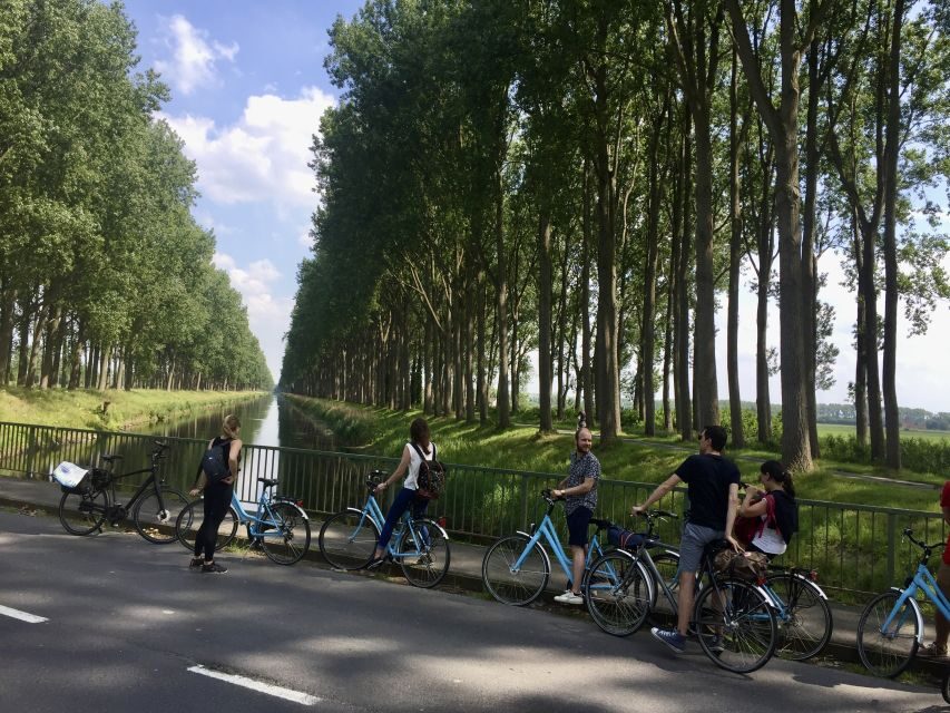 Bruges: Flatlands Guided Bike Tour - Oostkerke’s flat towers and the visual signature of the flatlands
