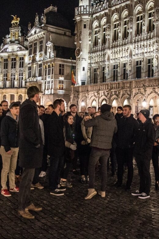 Brussels: Pub Crawl and Nightlife Party Experience - Stop 1 at the meeting venue: JagerBomb, first cheers, and getting placed