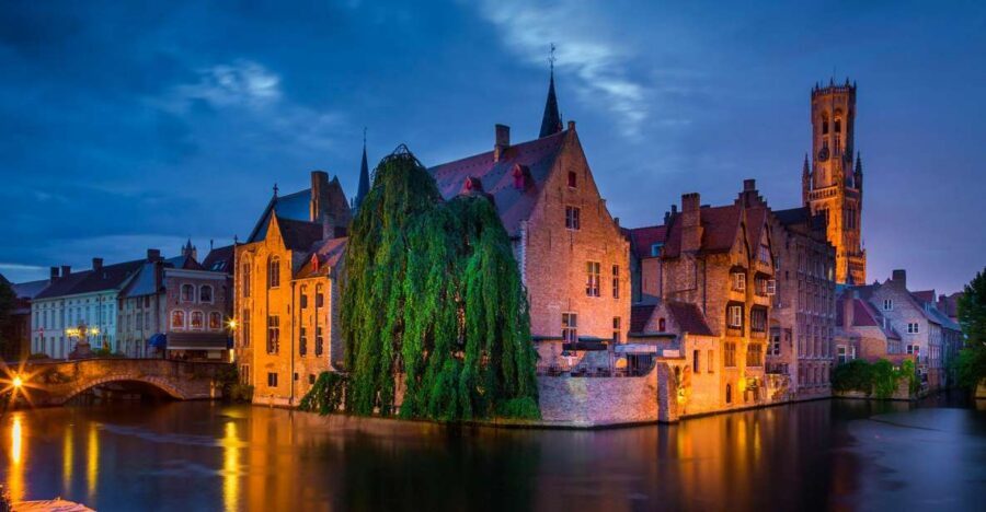 From Amsterdam: Bruges Day Trip in English with Boat Option - The Coach Ride: Pickup at Aloha Bowling and the 12-Hour Reality