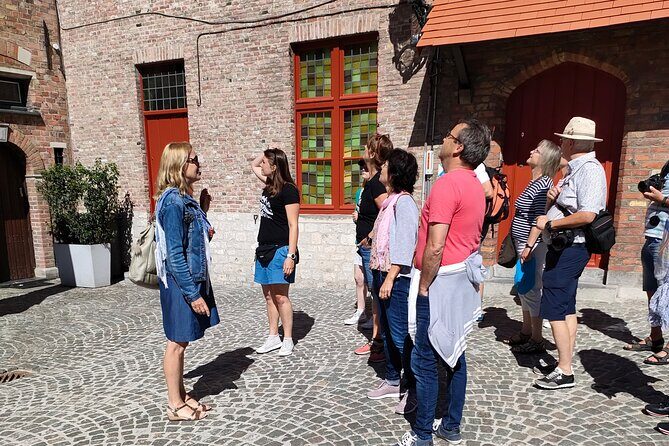Private tour: From your hotel + see the Madonna of Michelangelo - Ten Wijngaarde Beguinage: a quiet break inside white walls